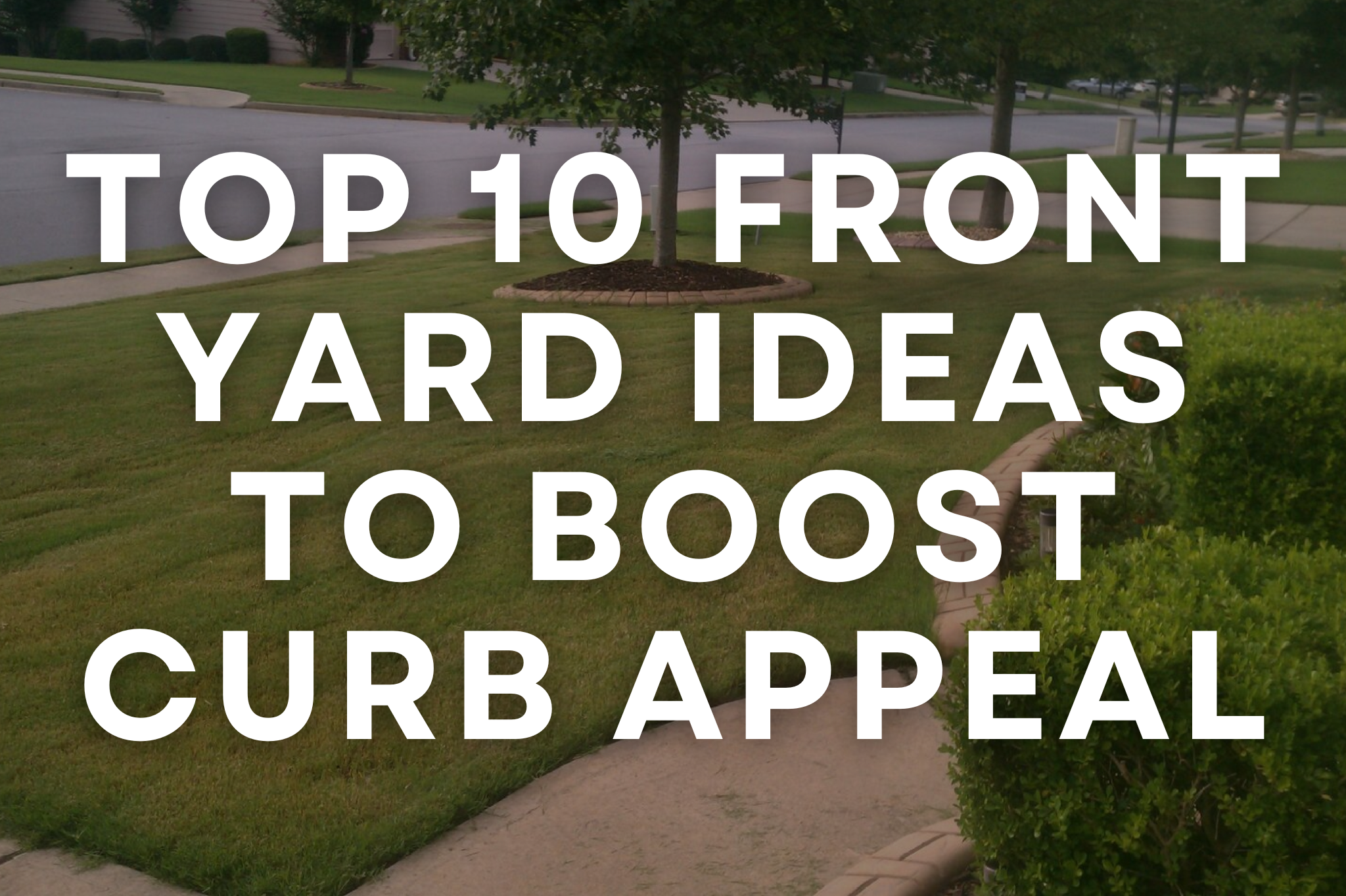 A beautifully landscaped Southern Utah front yard with clean edging, fresh mulch, and welcoming entryway planters