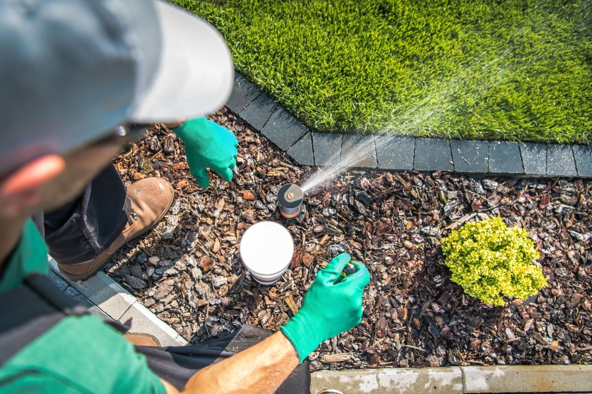 2. Water Is Spraying Onto Sidewalks, Driveways, or Other Hard Surfaces