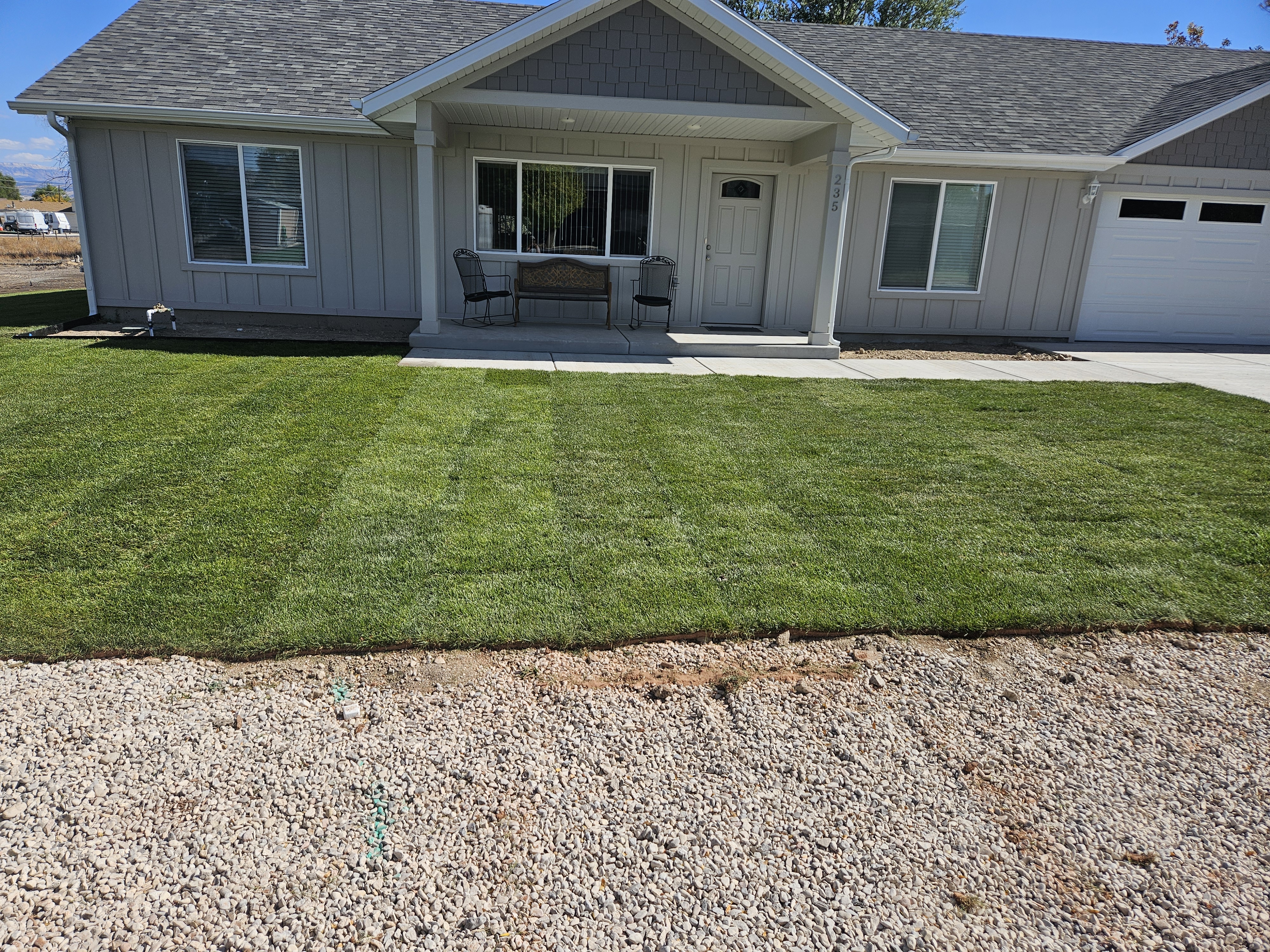 Desert landscape design with decorative rock mulch, succulents, and drought-tolerant plants