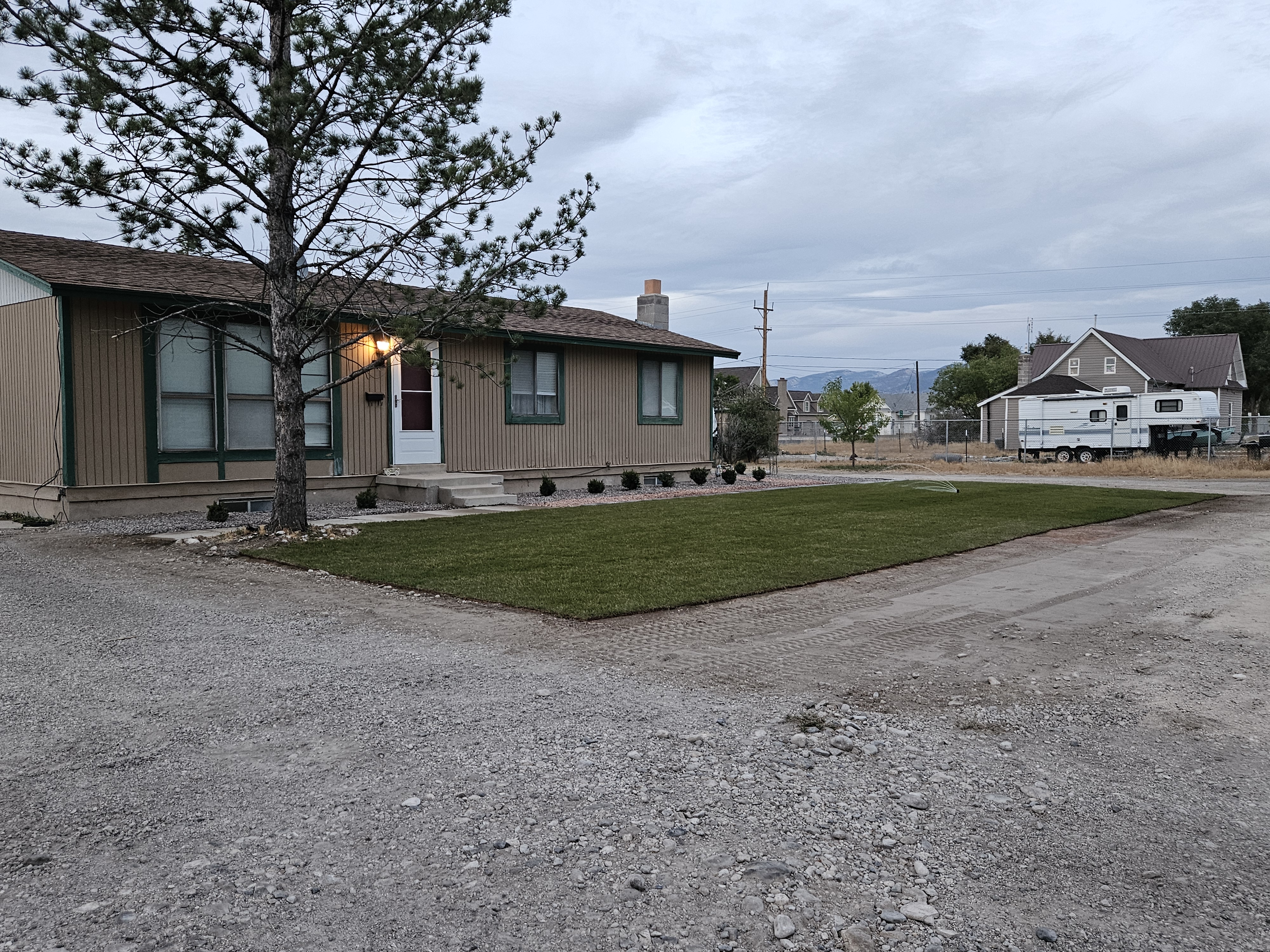Lush lawn after overseeding and soil amendment recovery program