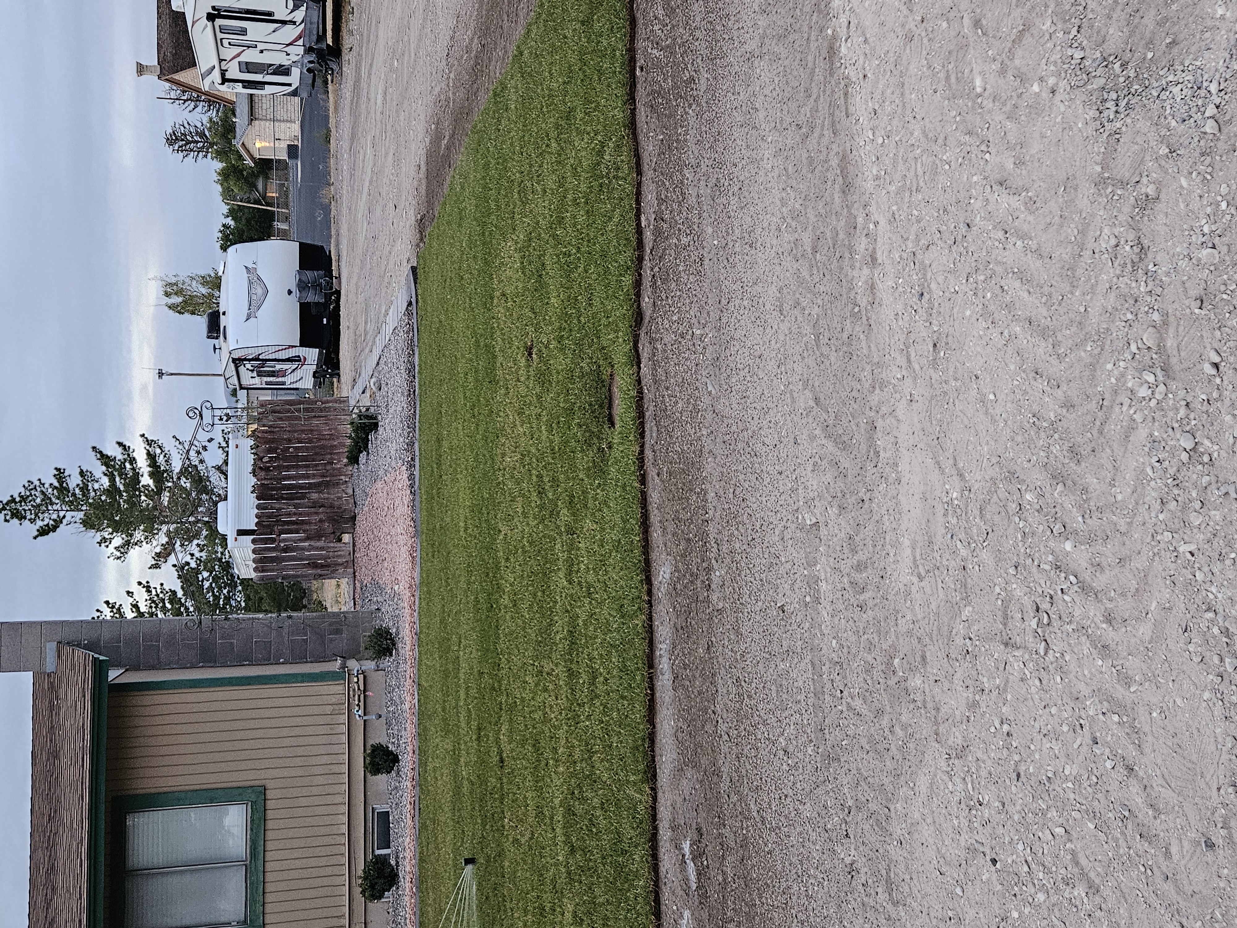Clean residential landscape after professional seasonal cleanup, edging, and mulching